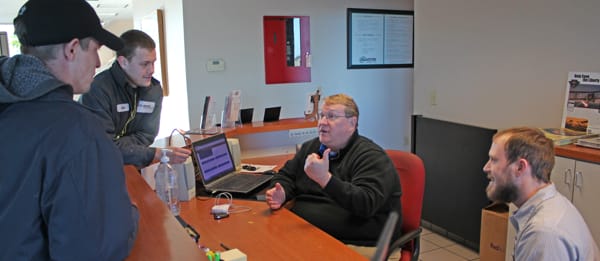 Employee helping customer