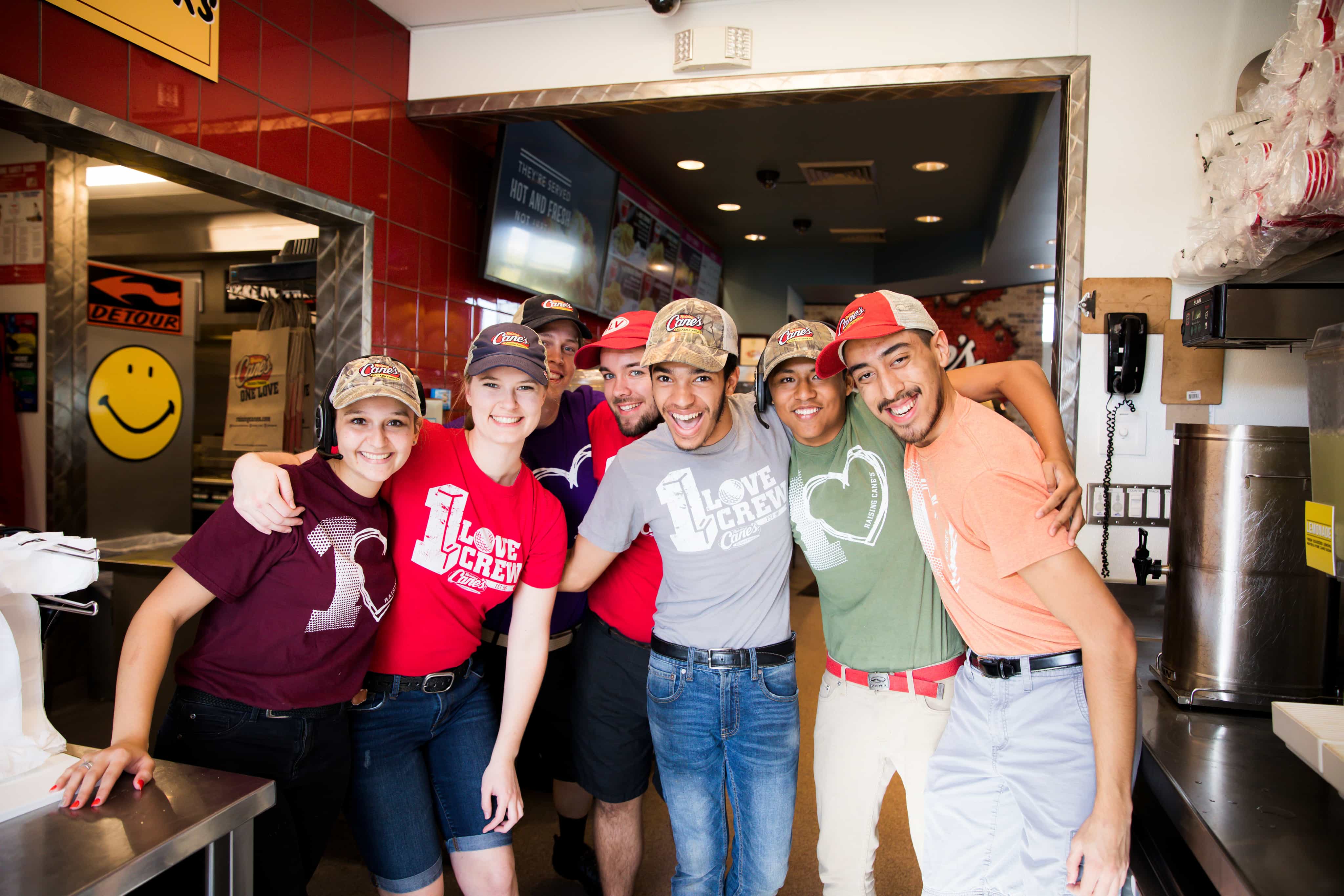 a group of people posing for a picture in a restaurant