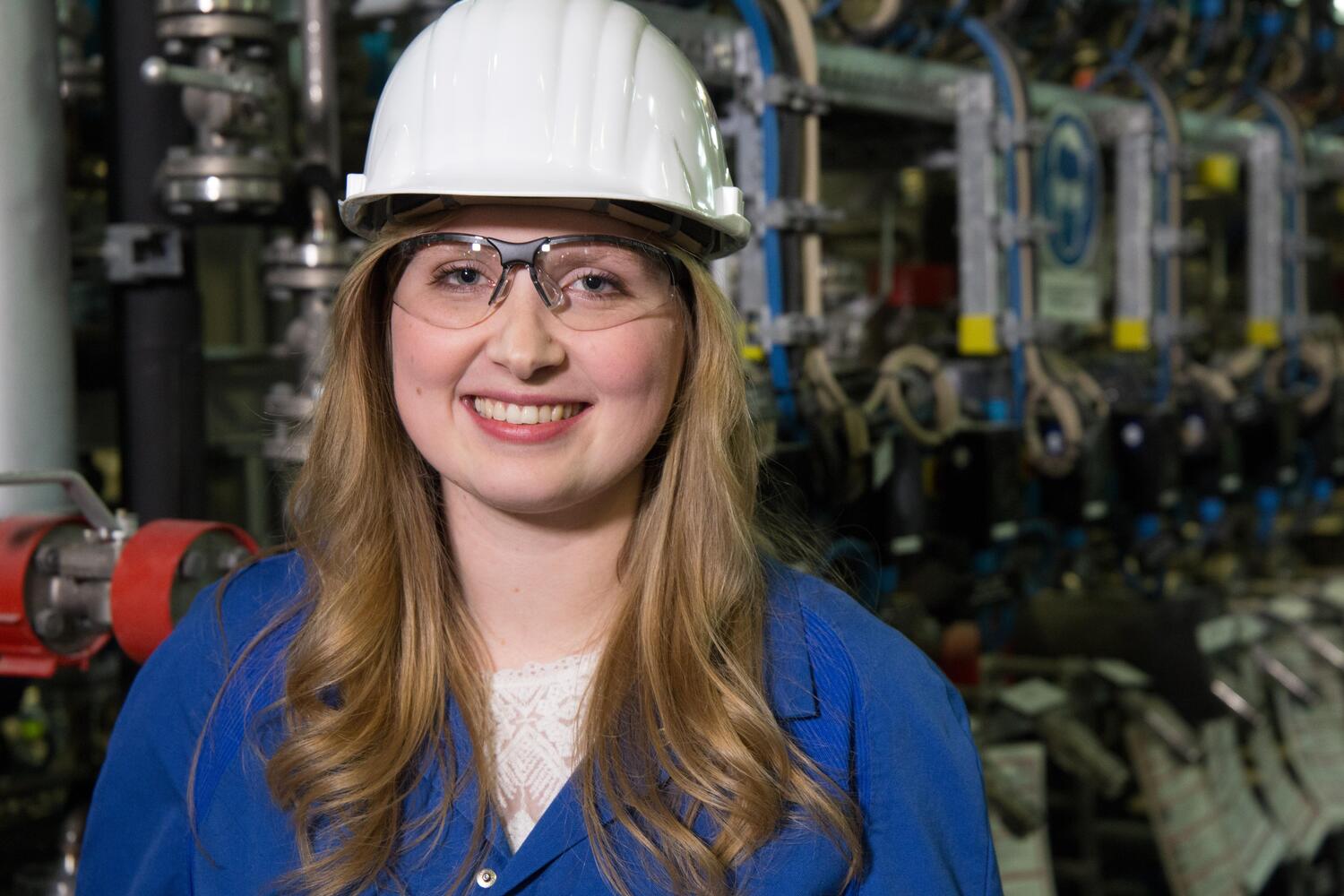 A female worker is smiling.