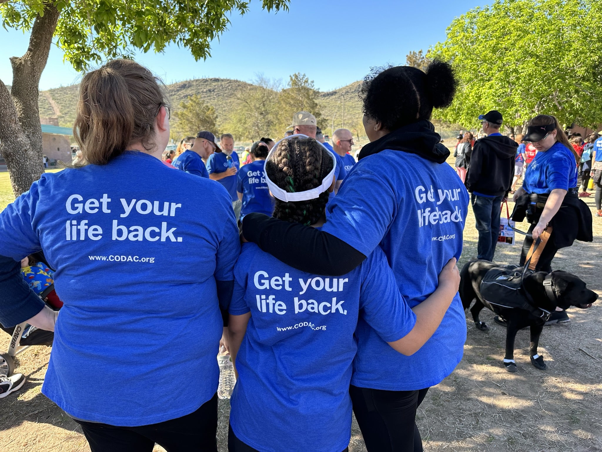 3 people wearing the same shirt that says 'Get your life back'